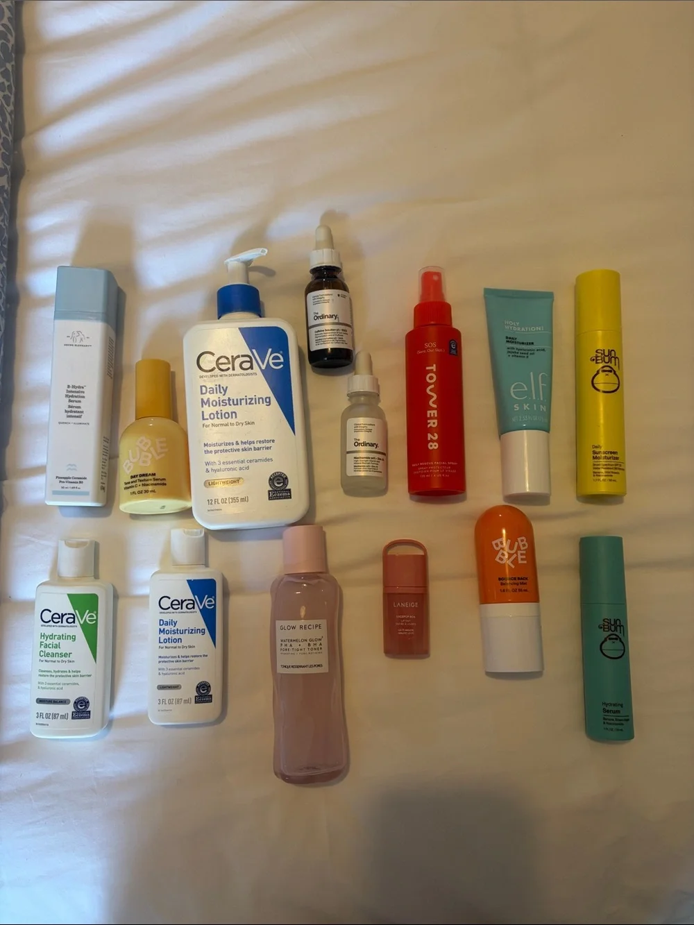 Assortment of various skincare and makeup products including